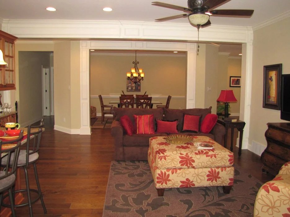 Living and dining area with hardwood floors and custom trim
